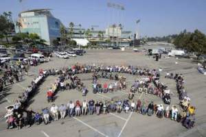 People roll through a parking lot near Dodger Stadium in Los Angeles as they celebrated the anniversary of the Americans with Disabilities Act in this file photo.
